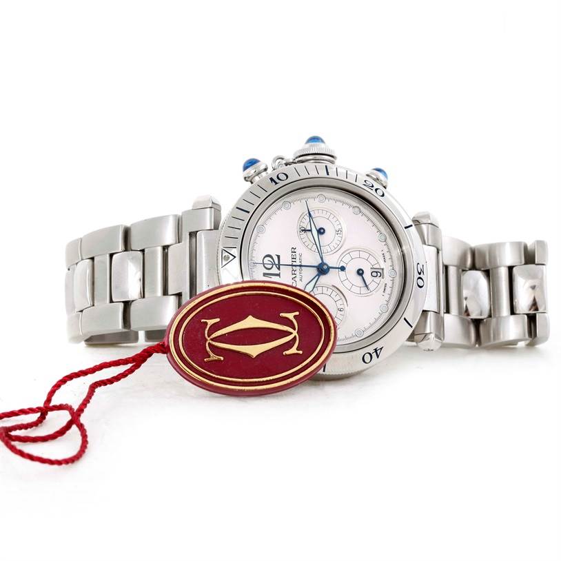 The Cartier Pasha W31030H3 Men
s Stainless Steel Silver Dial W31030H3 Men
s Stainless Steel Silver Dial watch is shown from a side angle, highlighting its dial, bezel, and metal bracelet.