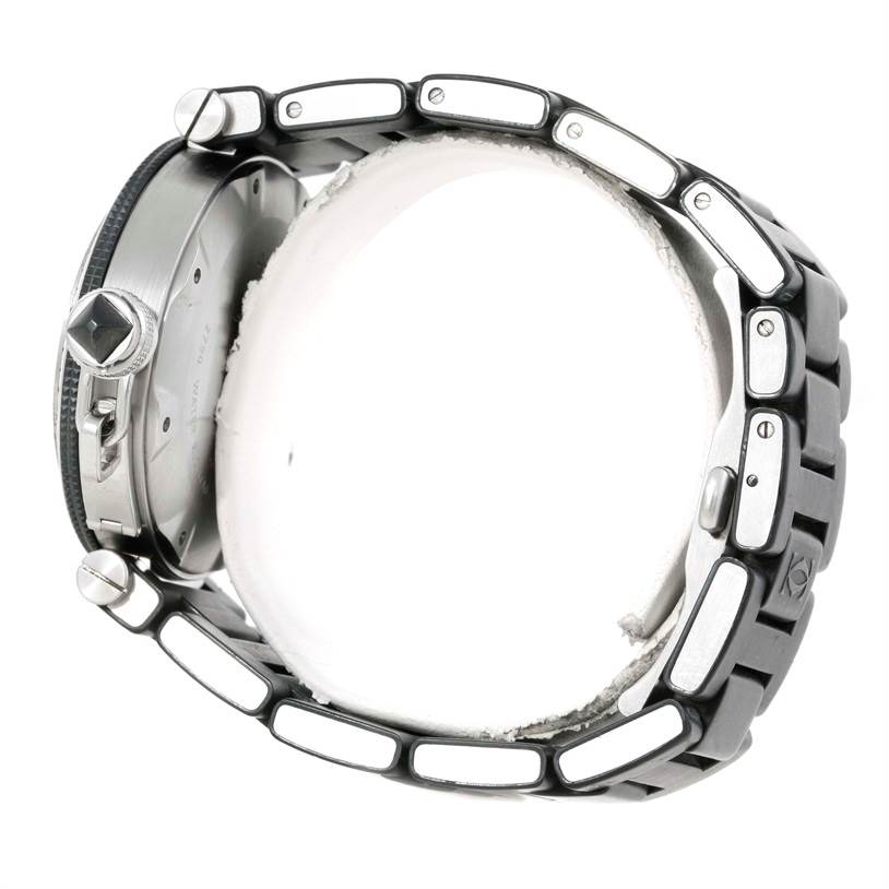 This image shows a side view of the Cartier Pasha W31077U2 Men's Stainless Steel Black Dial W31077U2 Men's Stainless Steel Black Dial watch, highlighting the watch case, crown, and bracelet links.