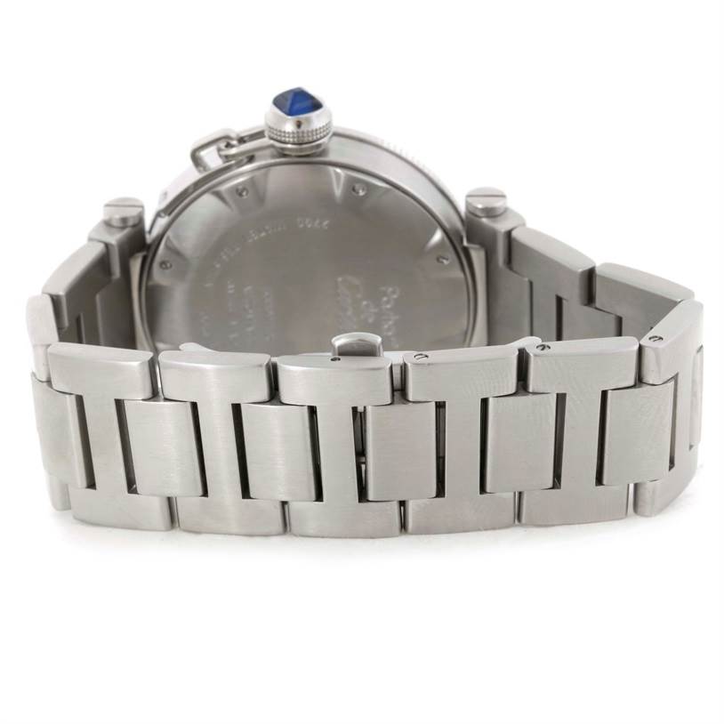 The image shows the back view of a Pasha de Cartier watch, highlighting the stainless steel bracelet and case back.