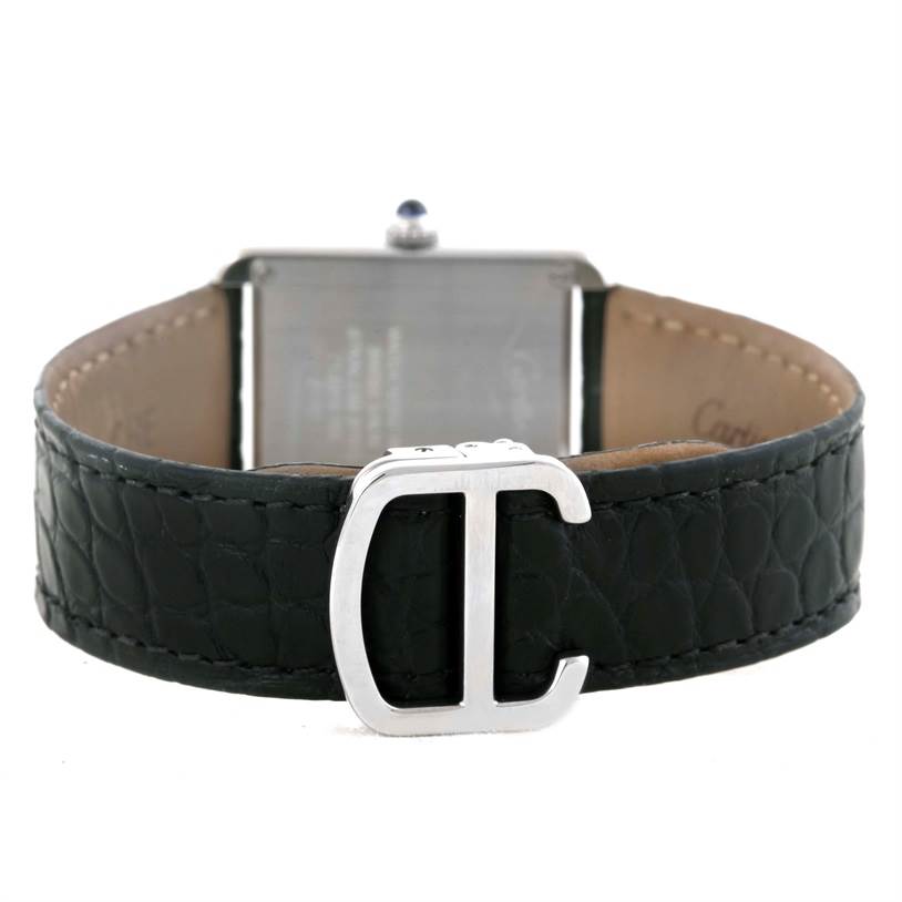 This image shows the back of the Cartier Tank Solo W1018255 Women's Stainless Steel Silver Dial W1018255 Women's Stainless Steel Silver Dial watch with a focus on its black leather strap and "C" buckle.