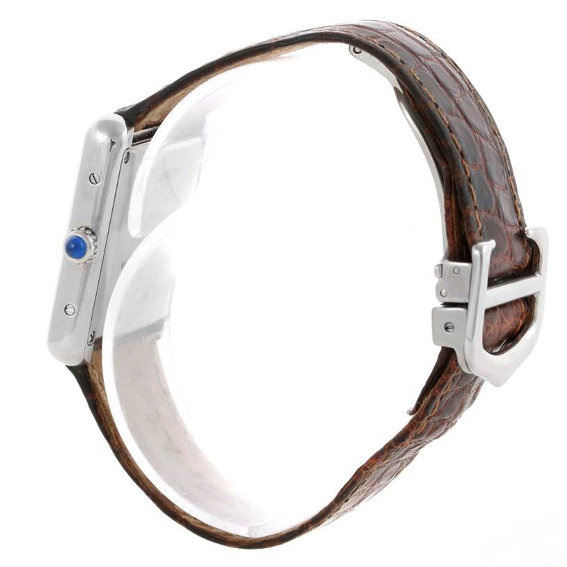 This image shows a side view of the Cartier Tank Solo W1018255 Women's Stainless Steel Silver Dial W1018255 Women's Stainless Steel Silver Dial watch, highlighting its crown and leather strap with buckle.