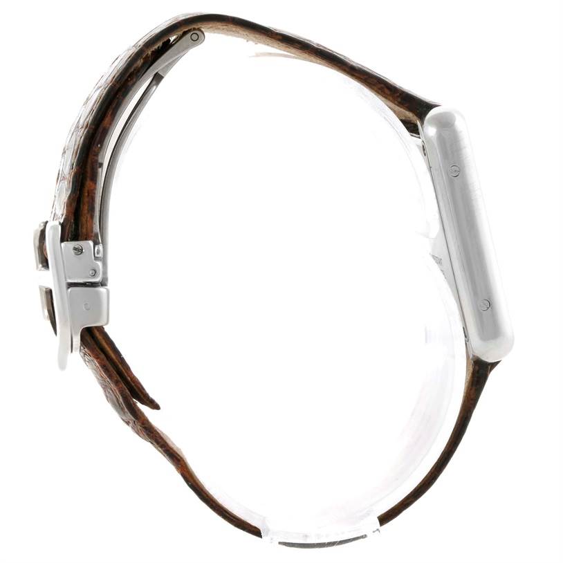 This is a side view of the Cartier Tank Solo W1018255 Women's Stainless Steel Silver Dial W1018255 Women's Stainless Steel Silver Dial watch, showing the case, lugs, and leather strap with buckle.