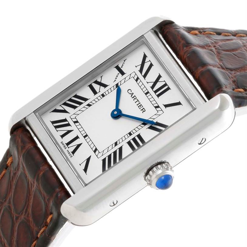 The image shows a close-up angle of the Cartier Tank Solo W1018255 Women's Stainless Steel Silver Dial W1018255 Women's Stainless Steel Silver Dial watch, displaying the face, blue hands, crown, and brown leather strap.