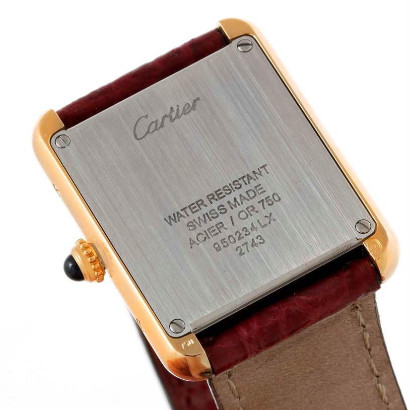 The image shows the back case and leather strap of a Cartier Tank Solo W1018755 Women's Steel and Gold (two tone) Silver Dial W1018755 Women's Steel and Gold (two tone) Silver Dial watch.