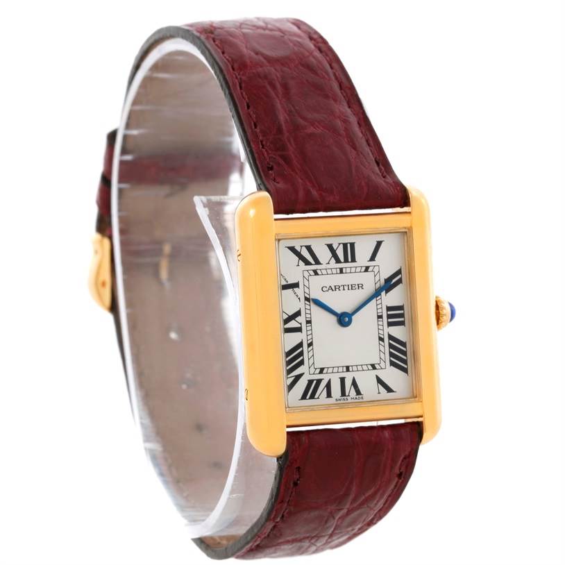 The Cartier Tank Solo W1018755 Women's Steel and Gold (two tone) Silver Dial W1018755 Women's Steel and Gold (two tone) Silver Dial watch is shown at a three-quarter angle, displaying the face, casing, and burgundy leather strap.