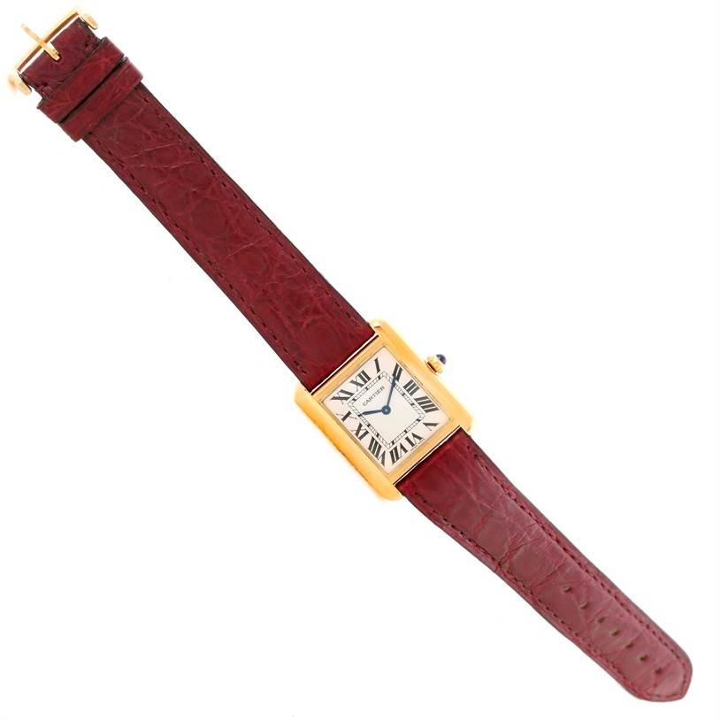 The image shows a Cartier Tank Solo W1018755 Women's Steel and Gold (two tone) Silver Dial W1018755 Women's Steel and Gold (two tone) Silver Dial watch, displayed flat from an overhead view, showcasing the face and entire strap.