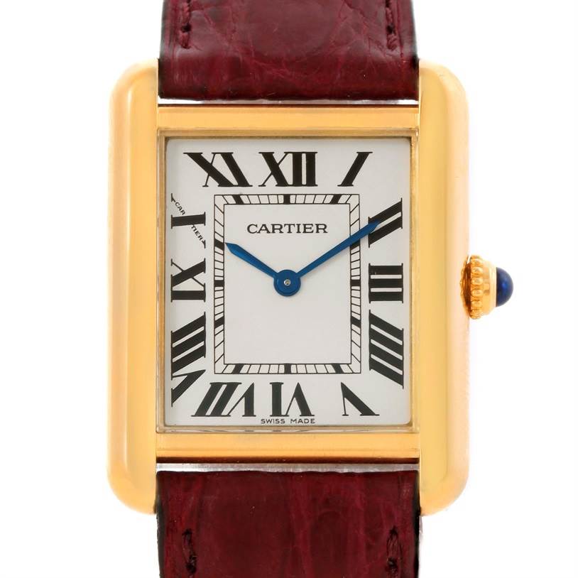 This image shows a front view of the Cartier Tank Solo W1018755 Women's Steel and Gold (two tone) Silver Dial W1018755 Women's Steel and Gold (two tone) Silver Dial watch, highlighting its face, gold case, strap, and crown with a blue cabochon.