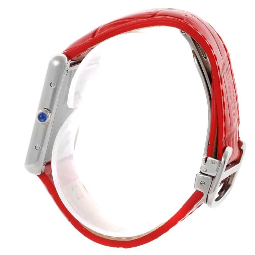 The image shows a side view of the Cartier Tank Solo W1018355 Women's Stainless Steel Silver Dial W1018355 Women's Stainless Steel Silver Dial watch, highlighting the red leather strap and the crown on the case.