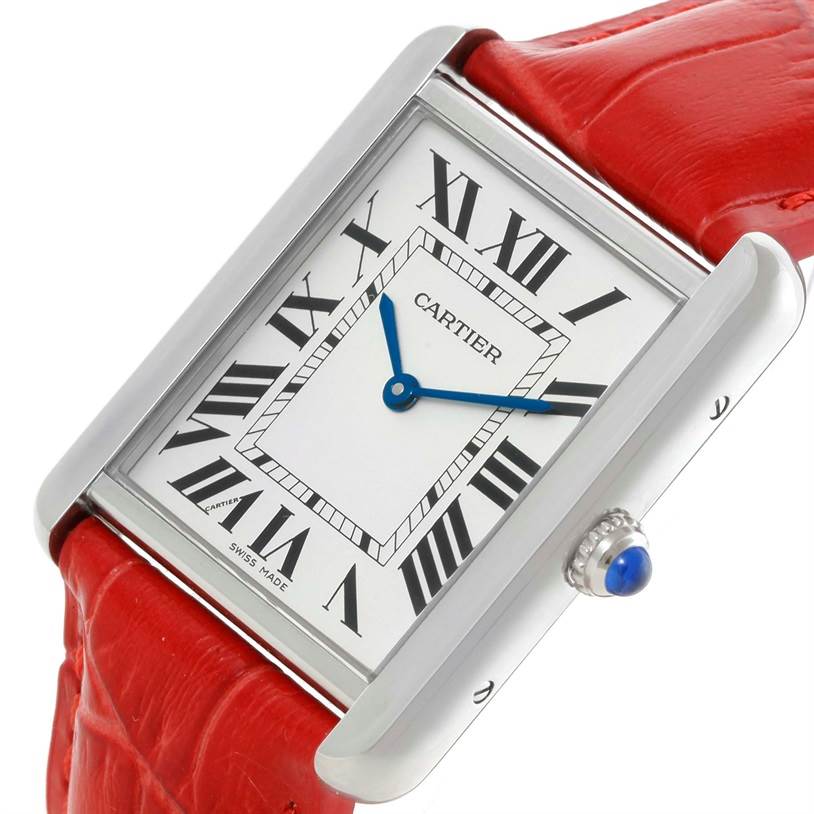 The image shows a Cartier Tank Solo W1018355 Women's Stainless Steel Silver Dial W1018355 Women's Stainless Steel Silver Dial watch at a slight angle, displaying its dial, blue hands, Roman numerals, and red strap.