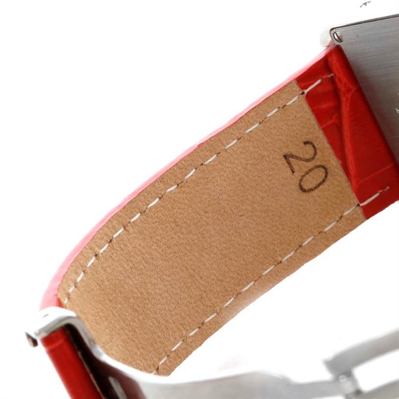 This image shows the underside of the red leather strap and partial clasp of a Cartier Tank Solo W1018355 Women's Stainless Steel Silver Dial W1018355 Women's Stainless Steel Silver Dial watch.
