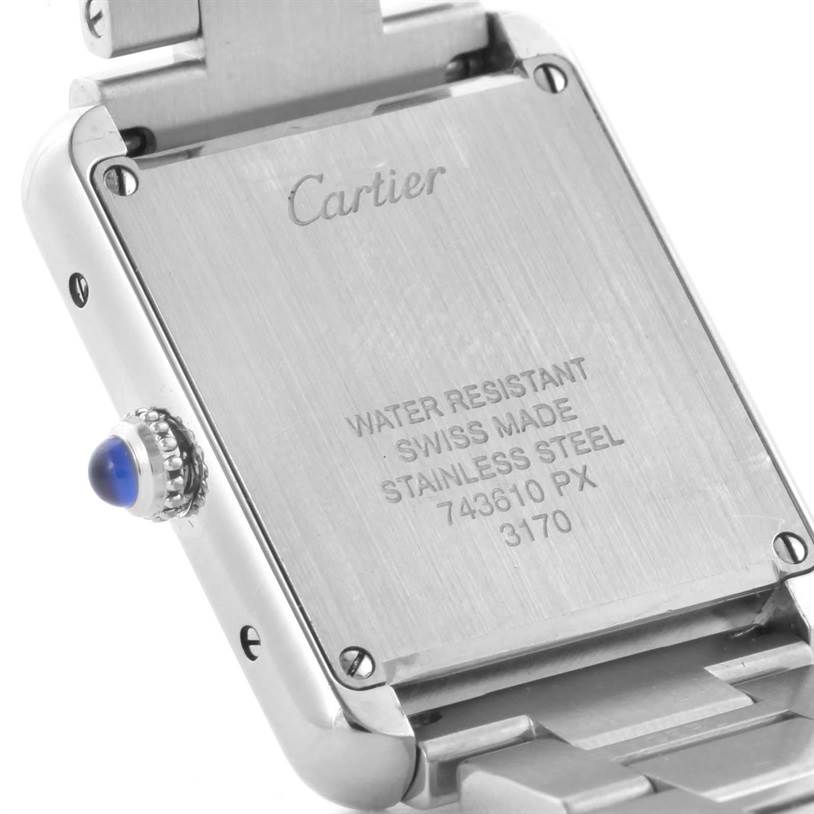 The image shows the back of a Tank Solo watch by Cartier, detailing its water resistance and stainless steel composition.