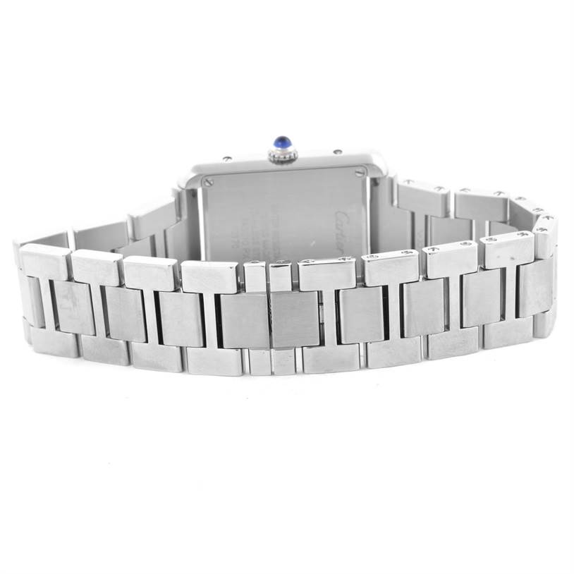 The image shows the back of a Cartier Tank Solo W5200013 Women
s Stainless Steel Silver Dial W5200013 Women
s Stainless Steel Silver Dial watch and its metal bracelet band.