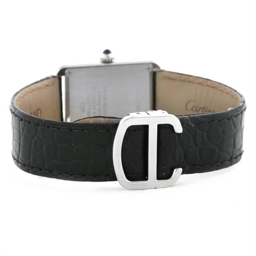 The image shows a rear view of a Cartier Tank Solo W1018255 Women
s Stainless Steel Silver Dial W1018255 Women
s Stainless Steel Silver Dial watch, focusing on its black leather strap and metal buckle.