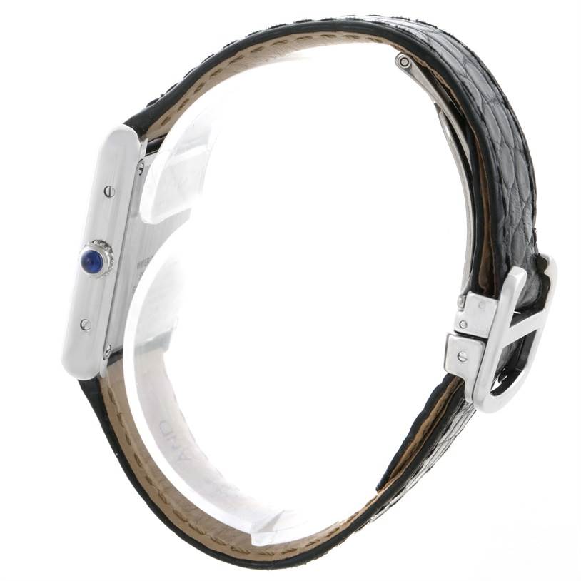 The image shows a side profile of the Cartier Tank Solo W1018255 Women
s Stainless Steel Silver Dial W1018255 Women
s Stainless Steel Silver Dial watch, highlighting its leather strap, buckle, and crown.