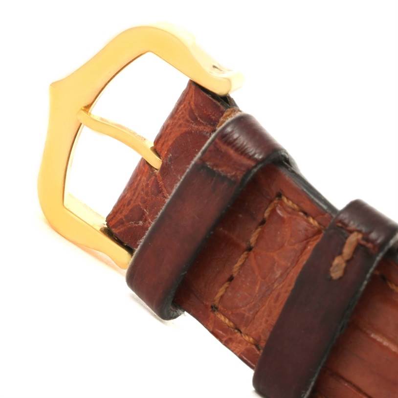 The image shows a close-up of the leather strap and gold buckle of a Cartier Tank Solo W1018755 Women's Steel and Gold (two tone) Silver Dial W1018755 Women's Steel and Gold (two tone) Silver Dial watch.