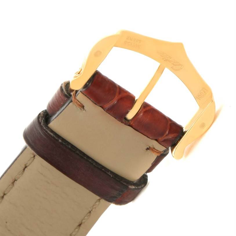 This image shows the gold buckle and brown leather strap of a Cartier Tank Solo W1018755 Women's Steel and Gold (two tone) Silver Dial W1018755 Women's Steel and Gold (two tone) Silver Dial watch from a partial top perspective.