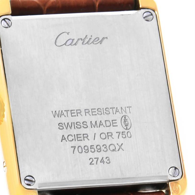 The image shows the back case of a Cartier Tank Solo W1018755 Women's Steel and Gold (two tone) Silver Dial W1018755 Women's Steel and Gold (two tone) Silver Dial watch, including the brand engraving and specifications.