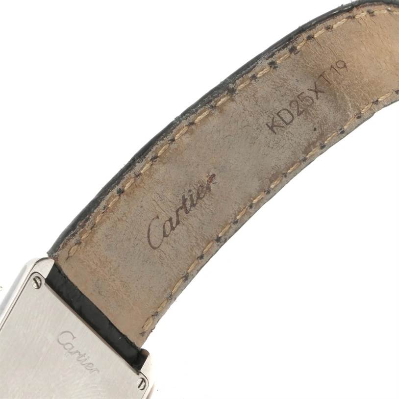 The image shows the inner side of the strap and part of the case back of a Cartier Tank Solo W1018255 Women
s Stainless Steel Silver Dial W1018255 Women
s Stainless Steel Silver Dial watch.