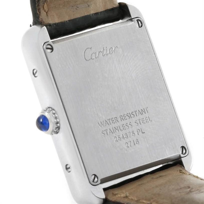 This image shows the back of a Tank Solo model by Cartier, highlighting the stainless steel case and the crown.