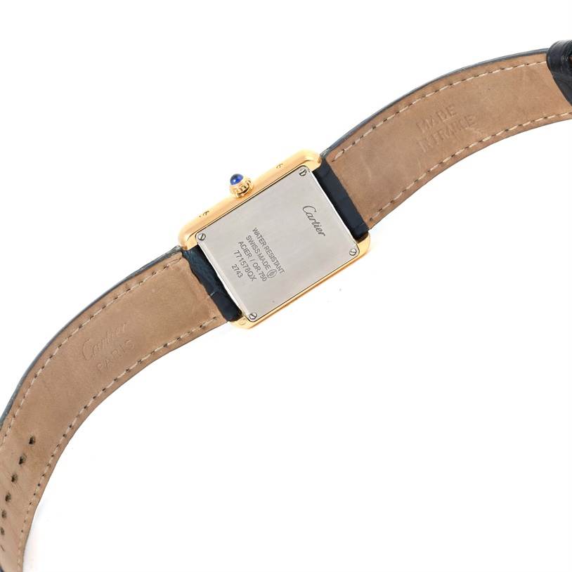 This image shows the back view of a Cartier Tank Solo W1018755 Women's Steel and Gold (two tone) Silver Dial W1018755 Women's Steel and Gold (two tone) Silver Dial watch, highlighting the case back and part of the leather strap.