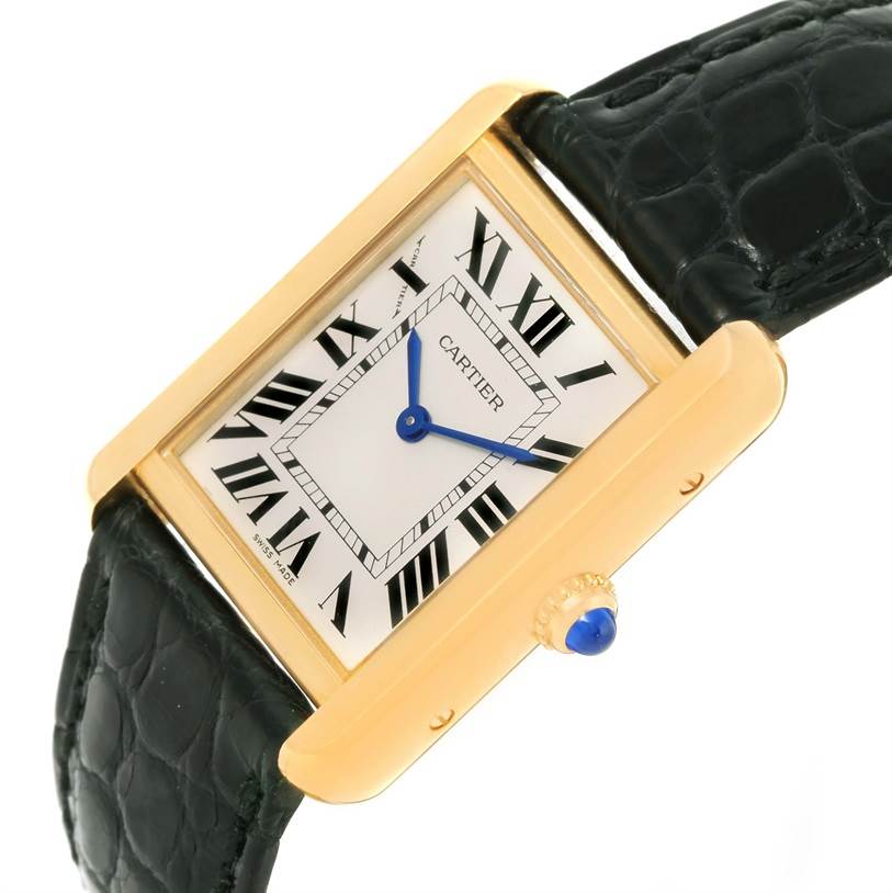 The image shows a close-up angled view of the Cartier Tank Solo W1018755 Women's Steel and Gold (two tone) Silver Dial W1018755 Women's Steel and Gold (two tone) Silver Dial watch, highlighting its rectangular gold case and black leather strap.