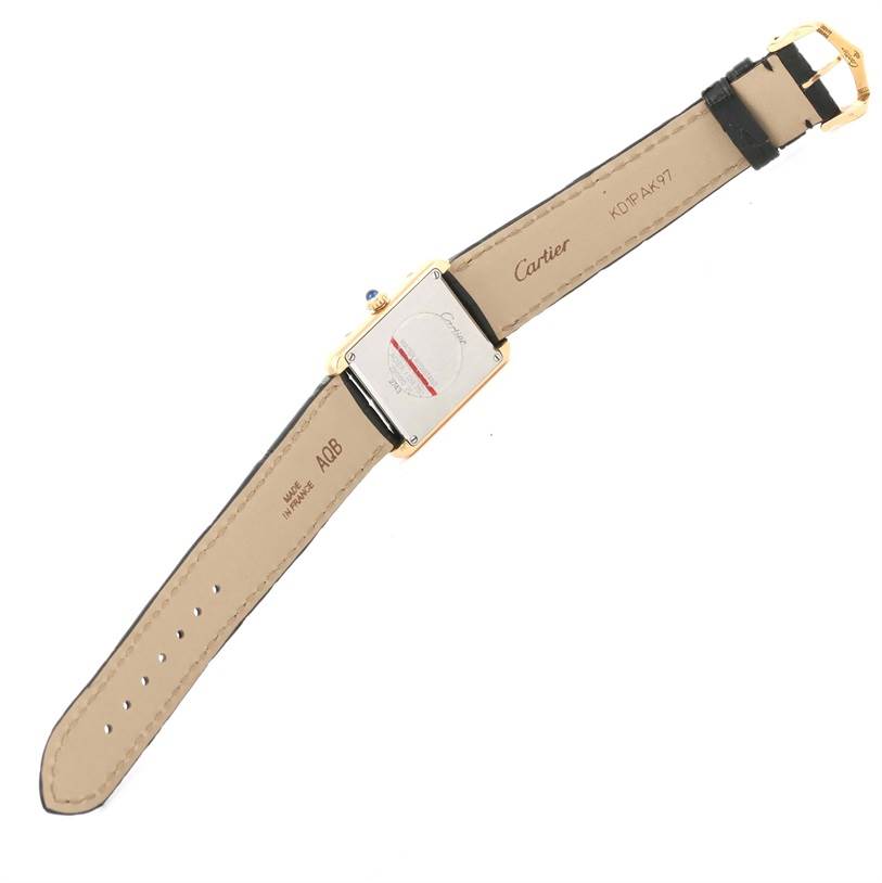 The image shows a Tank Solo model by Cartier from the back, displaying the case back, strap, and buckle.