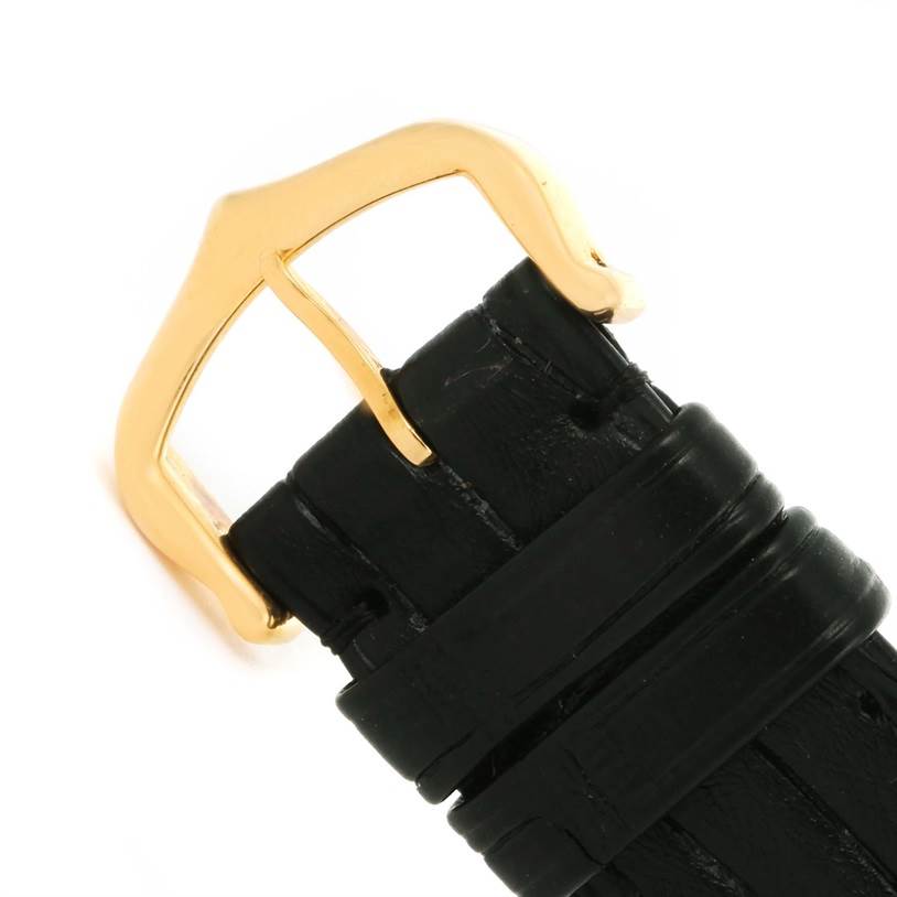 The image shows a close-up of the black leather strap and gold buckle of the Cartier Tank Solo W1018755 Women's Steel and Gold (two tone) Silver Dial W1018755 Women's Steel and Gold (two tone) Silver Dial watch.