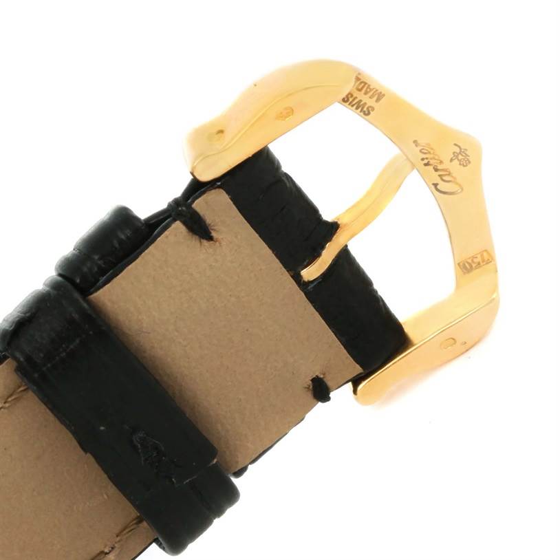 The image shows a close-up of the gold buckle and black leather strap of a Cartier Tank Solo W1018755 Women's Steel and Gold (two tone) Silver Dial W1018755 Women's Steel and Gold (two tone) Silver Dial watch.