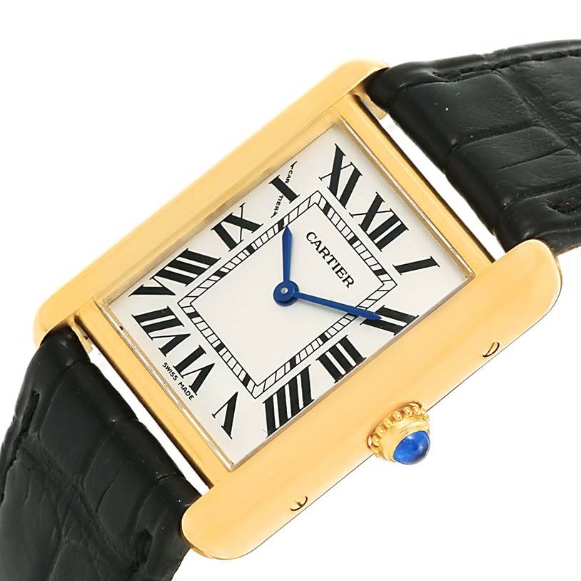 This image shows a close-up view of the Cartier Tank Solo W1018755 Women's Steel and Gold (two tone) Silver Dial W1018755 Women's Steel and Gold (two tone) Silver Dial watch, featuring its face, gold case, blue hands, and black leather strap.