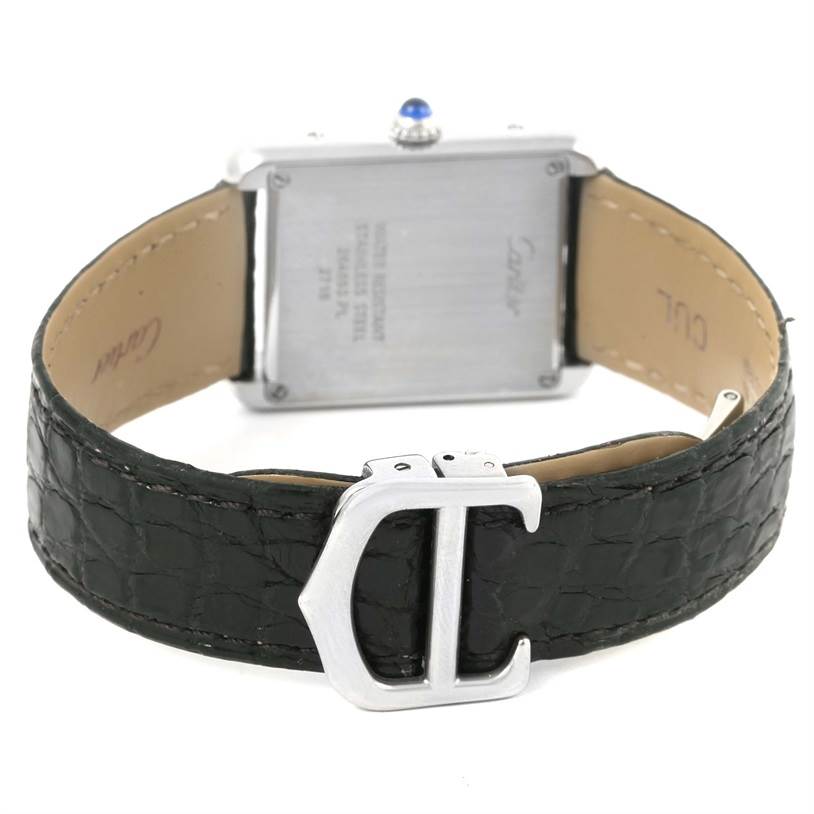 The image shows the back view of a Cartier Tank Solo W1018255 Women
s Stainless Steel Silver Dial W1018255 Women
s Stainless Steel Silver Dial watch, highlighting its leather strap and clasp.