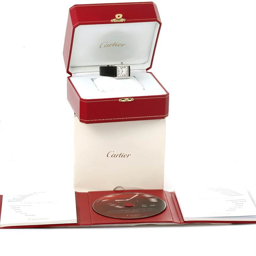 The image shows a Cartier Tank Solo W1018255 Women
s Stainless Steel Silver Dial W1018255 Women
s Stainless Steel Silver Dial watch in its open red box, accompanied by a CD and booklets.