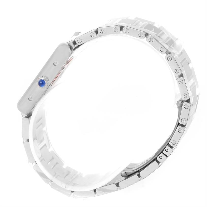 The image shows a side view of the Cartier Tank Solo W5200013 Women's Stainless Steel Silver Dial W5200013 Women's Stainless Steel Silver Dial watch, highlighting its metal bracelet and blue cabochon crown.