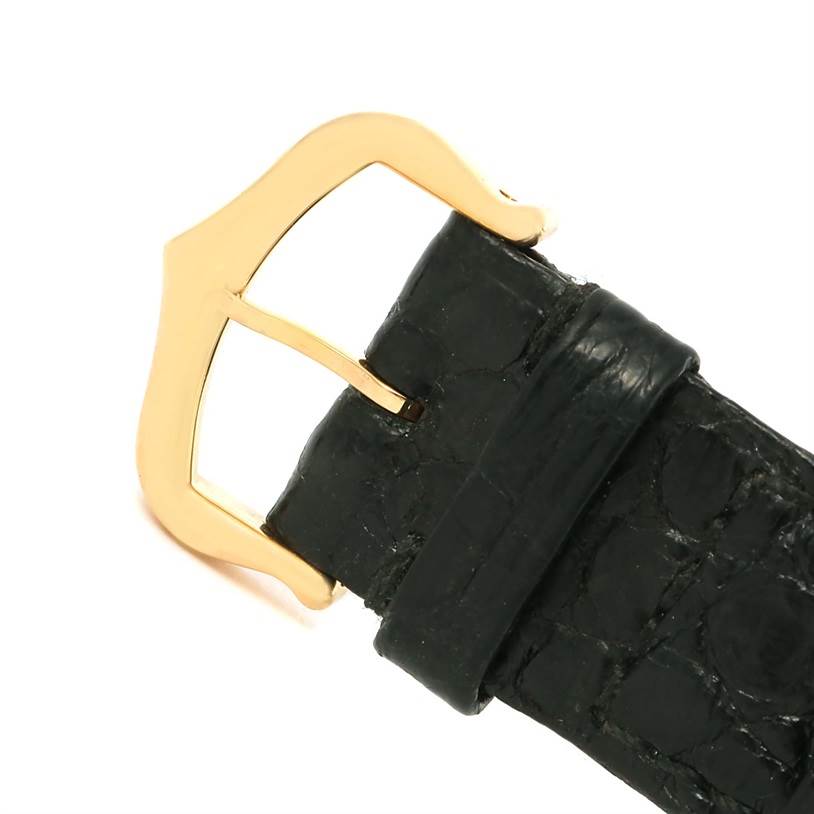 This image shows a close-up of the black leather strap and gold buckle of a Cartier Tank Solo W1018755 Women's Steel and Gold (two tone) Silver Dial W1018755 Women's Steel and Gold (two tone) Silver Dial watch.