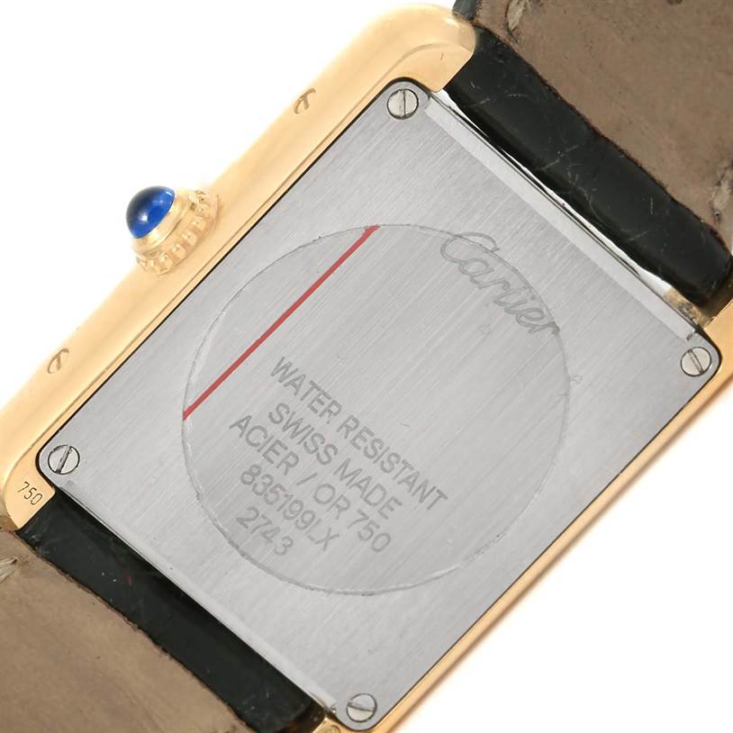 This image shows the back case and crown detail of a Cartier Tank Solo W1018755 Women's Steel and Gold (two tone) Silver Dial W1018755 Women's Steel and Gold (two tone) Silver Dial watch.