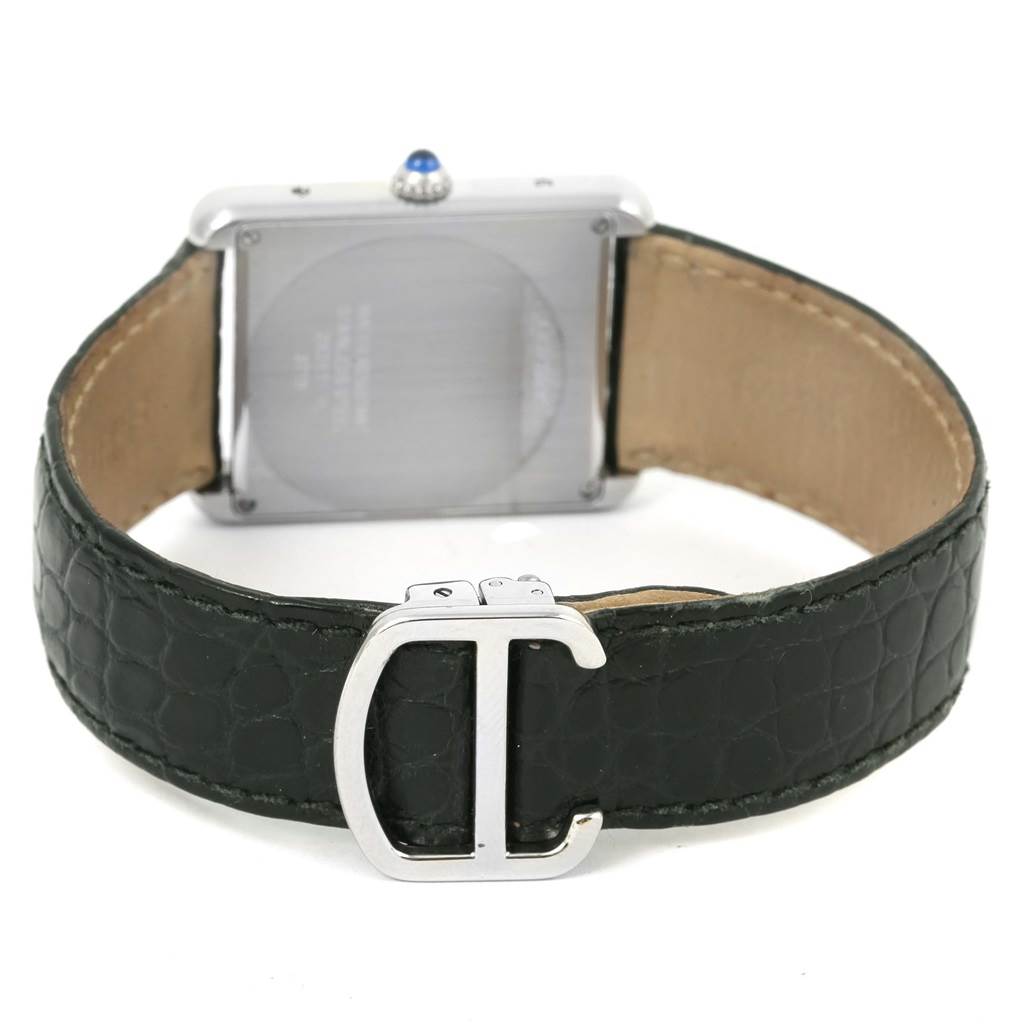 The image shows the back view of a Cartier Tank Solo W1018355 Men
s Stainless Steel Silver Dial W1018355 Men
s Stainless Steel Silver Dial watch, highlighting the clasp and leather strap.