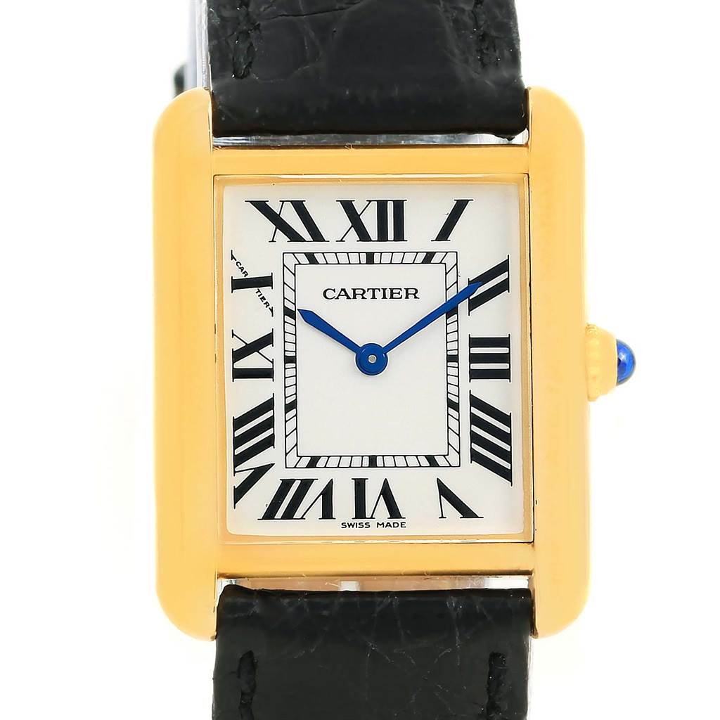 The image shows a front view of the Cartier Tank Solo W1018755 Women's Steel and Gold (two tone) Silver Dial W1018755 Women's Steel and Gold (two tone) Silver Dial watch, highlighting its rectangular dial, Roman numerals, blue hands, and black leather strap.