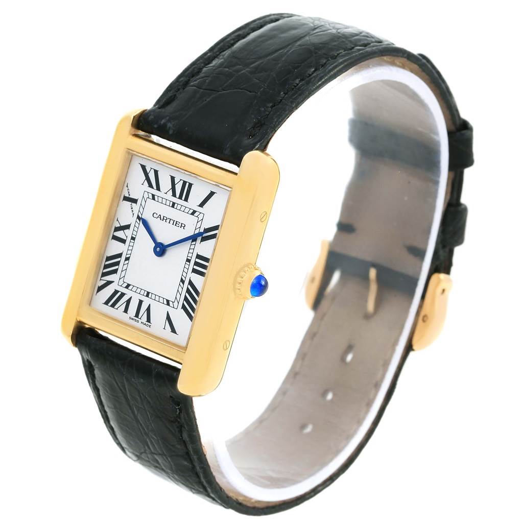 The Cartier Tank Solo W1018755 Women's Steel and Gold (two tone) Silver Dial W1018755 Women's Steel and Gold (two tone) Silver Dial watch is shown at a slight angle, showcasing its face, Roman numerals, and black leather strap.