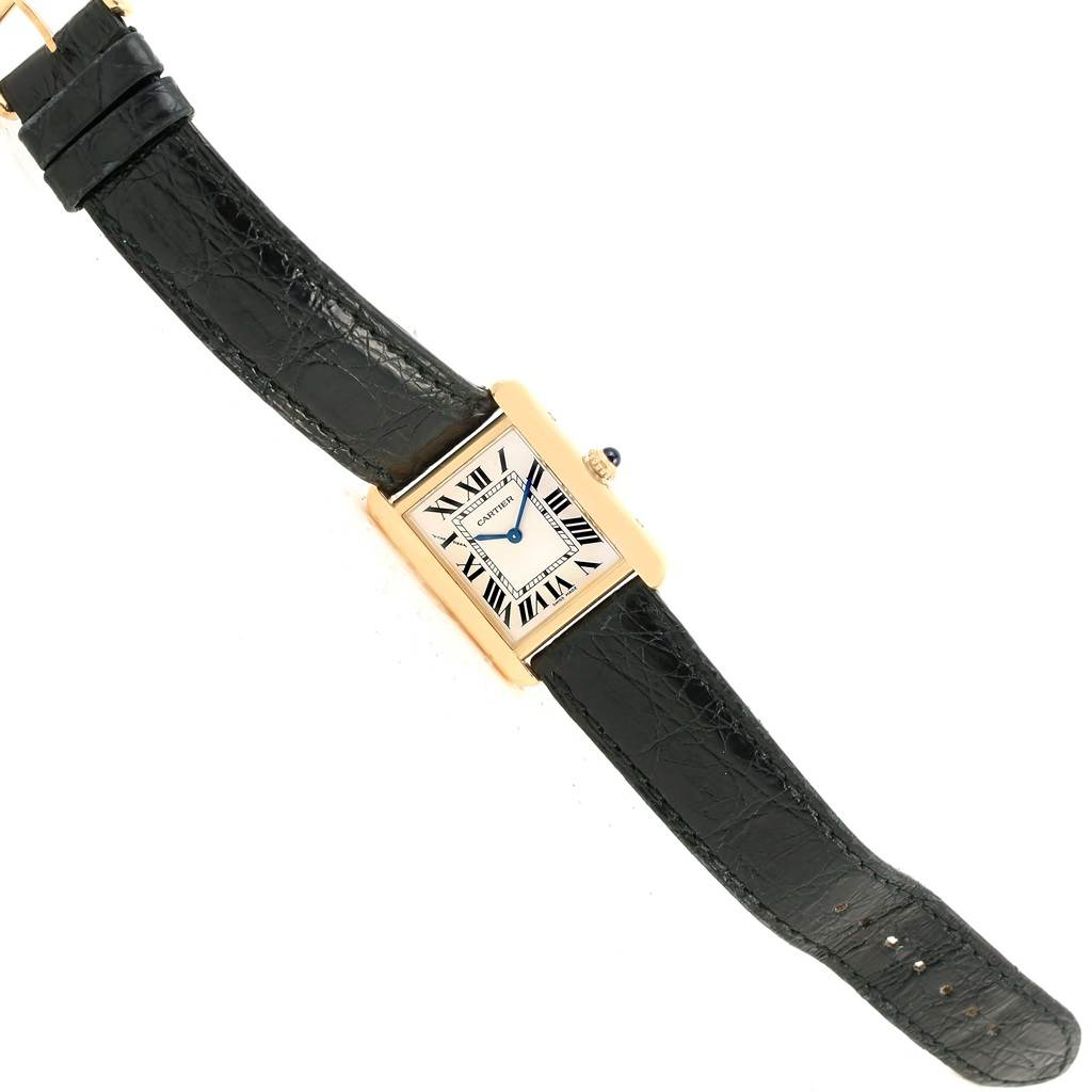 The Cartier Tank Solo W1018755 Women's Steel and Gold (two tone) Silver Dial W1018755 Women's Steel and Gold (two tone) Silver Dial watch is shown from a top-down angle, displaying the face, strap, and crown.