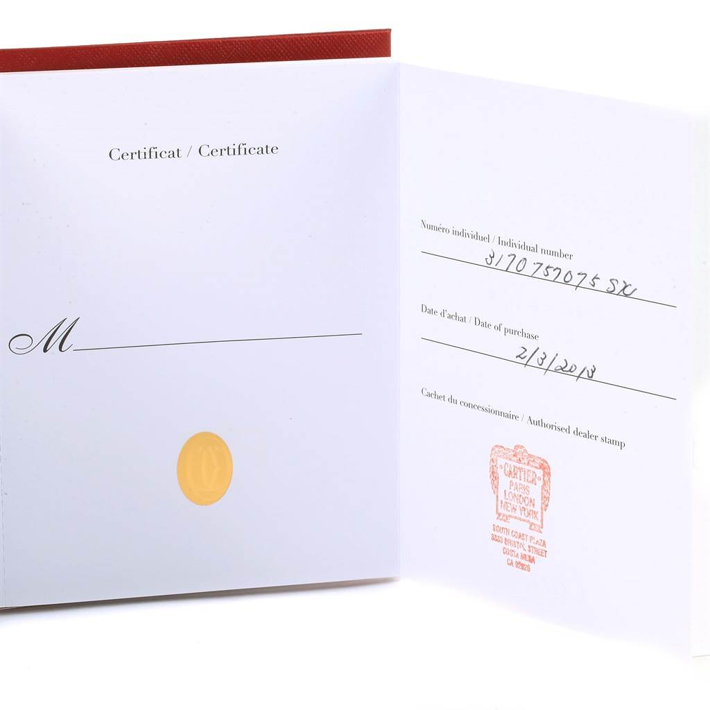 The image shows a certificate for the Cartier Tank Solo W1018255 Women
s Stainless Steel Silver Dial W1018255 Women
s Stainless Steel Silver Dial watch, including individual number, purchase date, and dealer stamp.