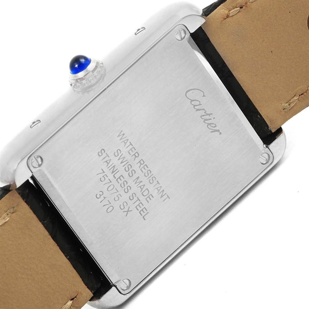 The image shows the back case and part of the leather strap of a Cartier Tank Solo W1018255 Women
s Stainless Steel Silver Dial W1018255 Women
s Stainless Steel Silver Dial watch.