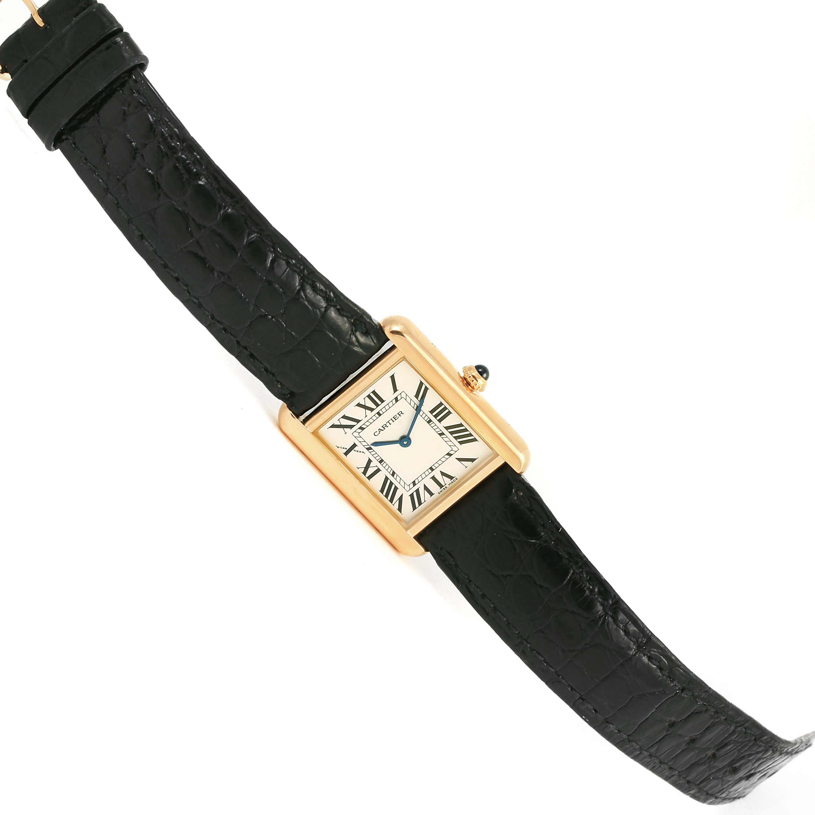 The image shows a Tank Solo watch by Cartier, highlighting its rectangular face, Roman numeral dial, leather strap, and gold case from a top-down angle.