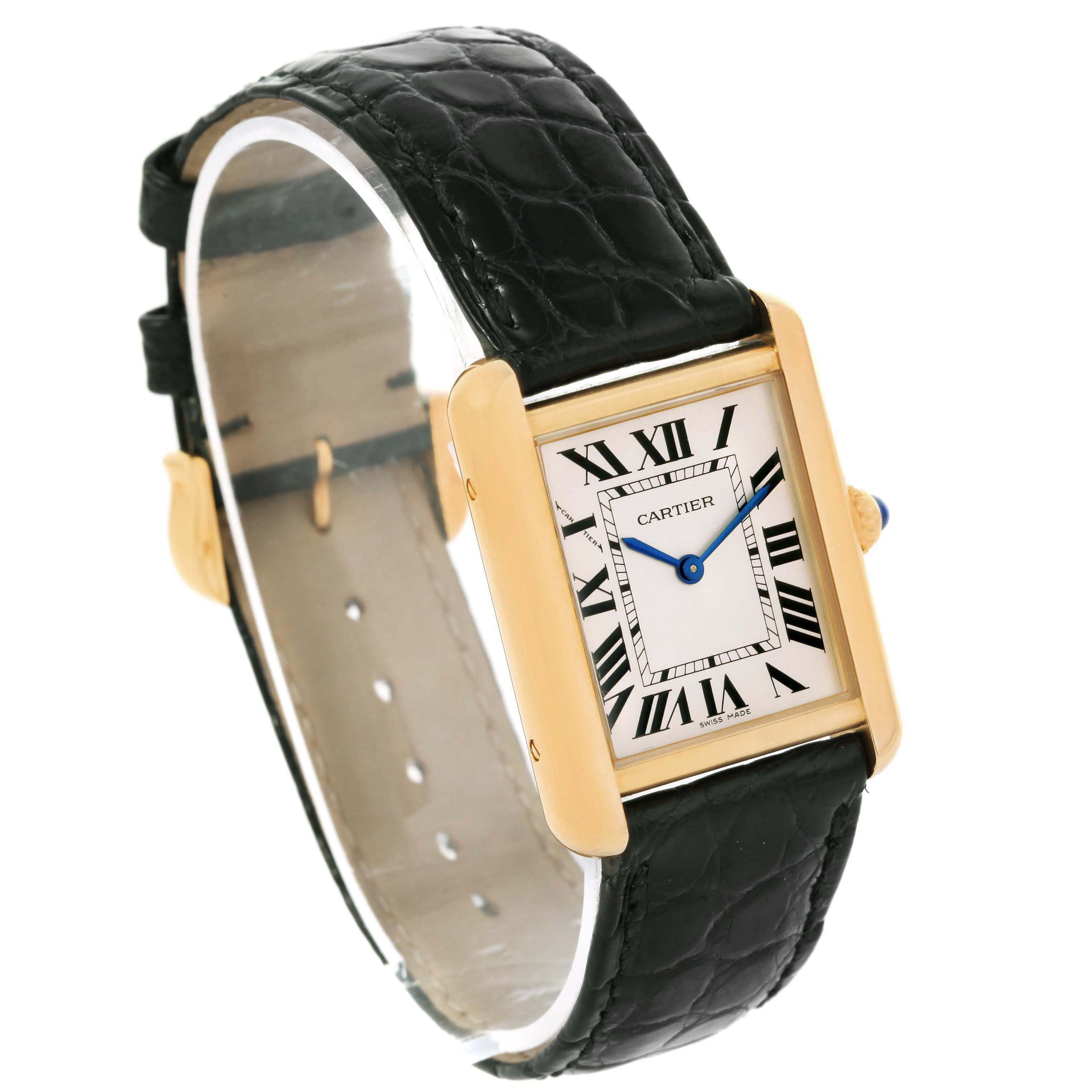 The image shows a Cartier Tank Solo W1018755 Women
s Steel and Gold (two tone) Silver Dial W1018755 Women
s Steel and Gold (two tone) Silver Dial watch viewed at an angle, highlighting the face, Roman numerals, blue hands, and black leather strap.