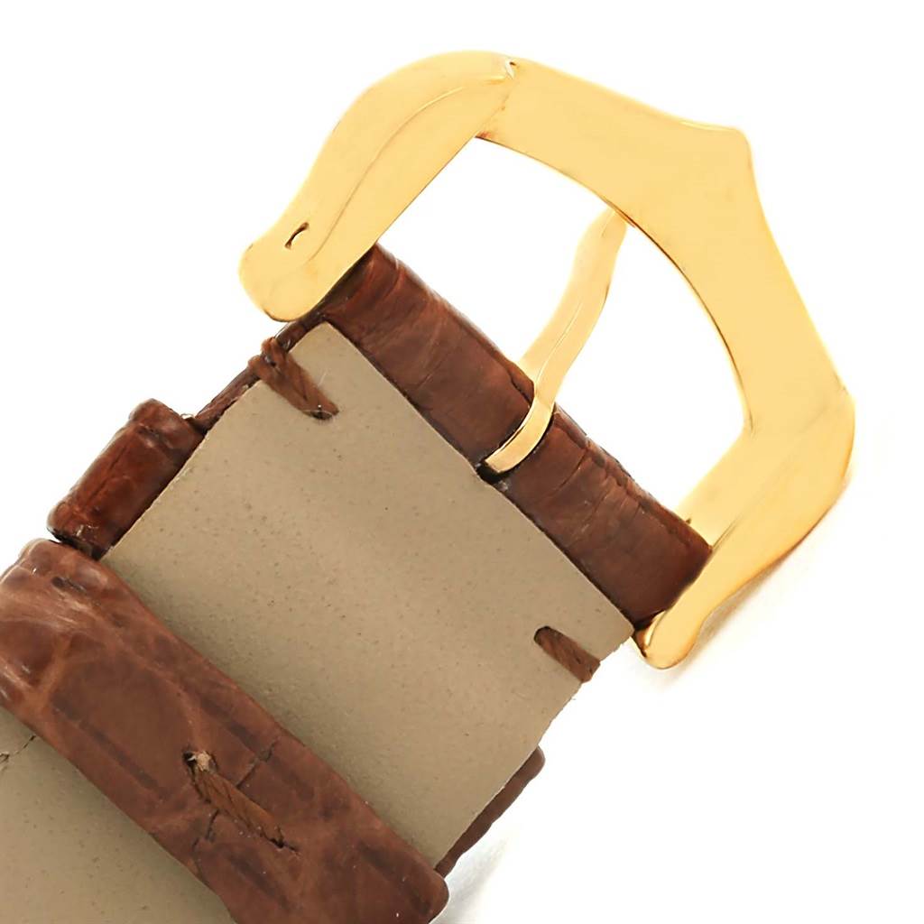 The image shows the gold buckle and part of the brown leather strap of the Cartier Tank Solo W1018755 Women's Steel and Gold (two tone) Silver Dial W1018755 Women's Steel and Gold (two tone) Silver Dial watch.