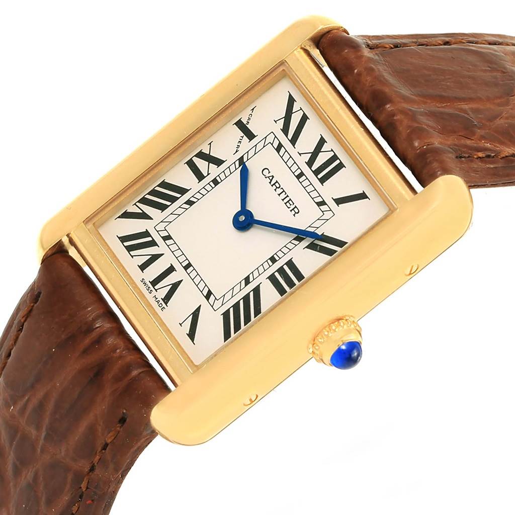 The image shows a close-up of the Cartier Tank Solo W1018755 Women's Steel and Gold (two tone) Silver Dial W1018755 Women's Steel and Gold (two tone) Silver Dial watch face, featuring the dial, hands, crown, and part of the leather strap.