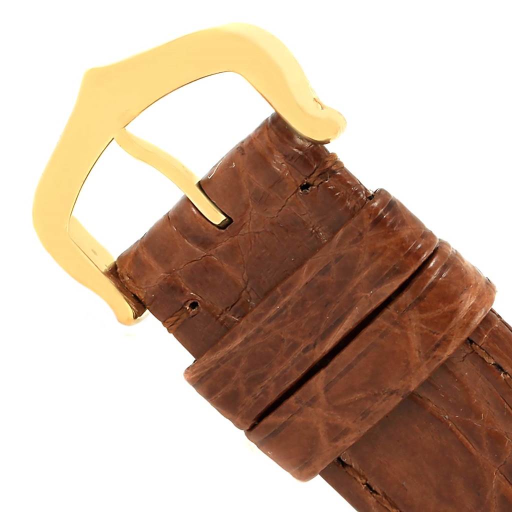 This image shows the buckle and part of the brown leather strap of a Cartier Tank Solo W1018755 Women's Steel and Gold (two tone) Silver Dial W1018755 Women's Steel and Gold (two tone) Silver Dial watch.