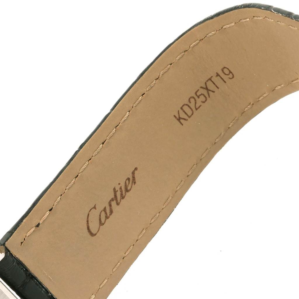 This image shows the inside of the strap of a Cartier Tank Solo W1018255 Women's Stainless Steel Silver Dial W1018255 Women's Stainless Steel Silver Dial watch, highlighting the brand engraving and serial number.