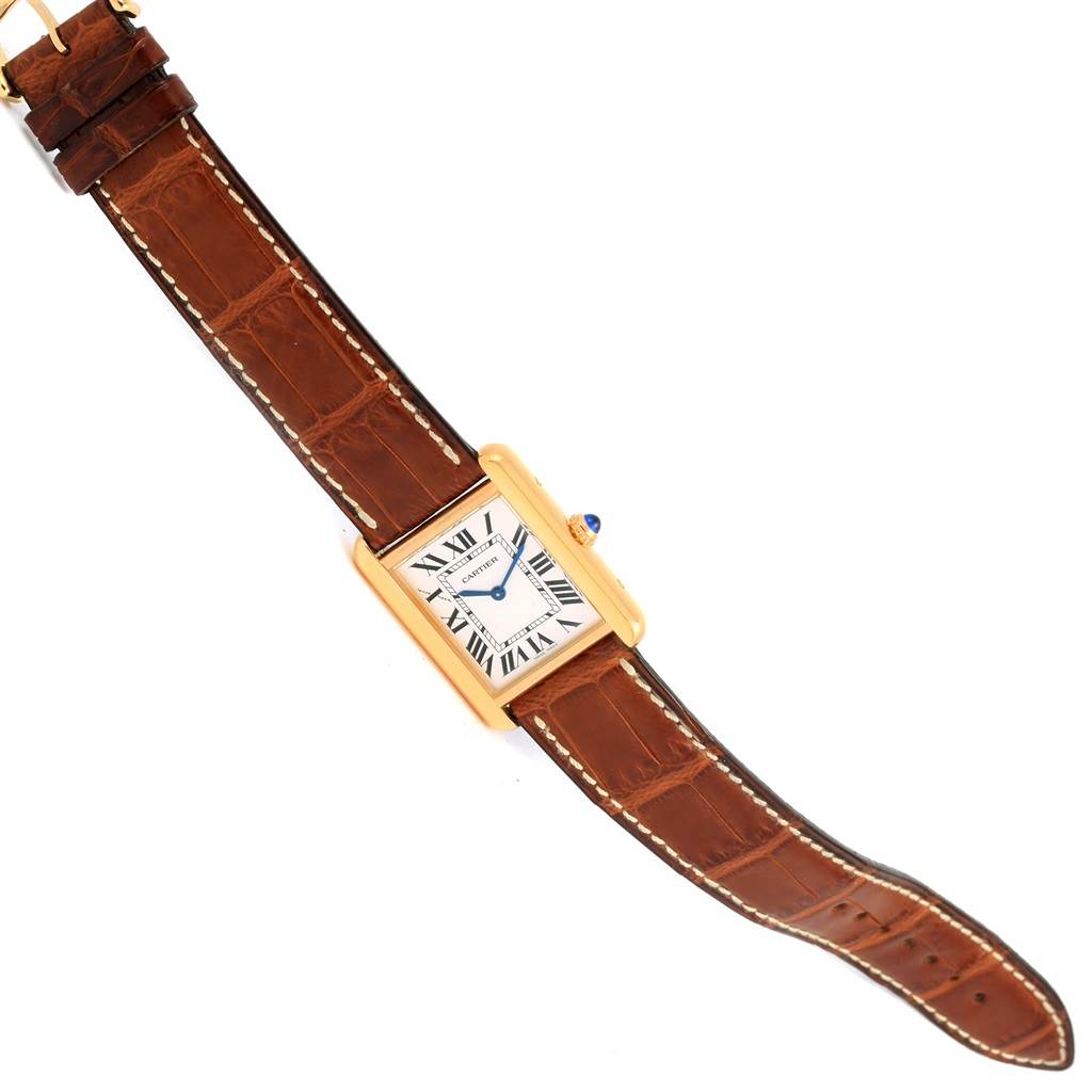 This image shows a top view of a Cartier Tank Solo W1018755 Women's Steel and Gold (two tone) Silver Dial W1018755 Women's Steel and Gold (two tone) Silver Dial watch, displaying its rectangular face and leather strap.