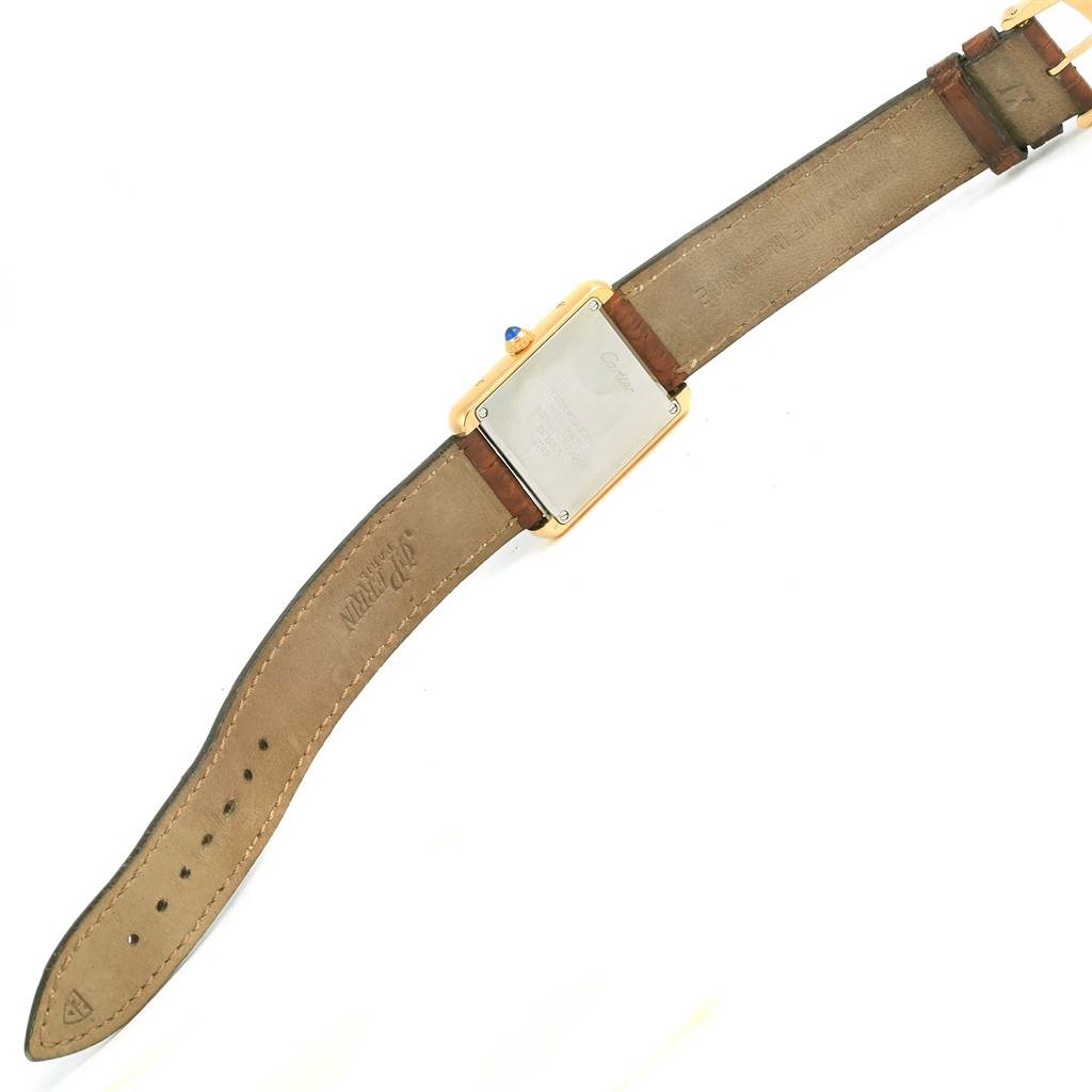 This image shows the back and leather strap of a Cartier Tank Solo W1018755 Women's Steel and Gold (two tone) Silver Dial W1018755 Women's Steel and Gold (two tone) Silver Dial watch, viewed from a flat angle.