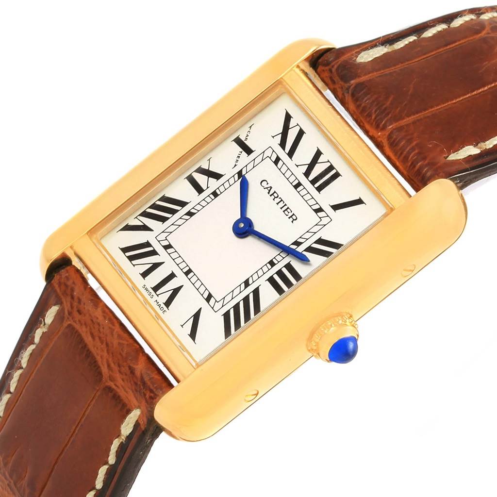 The image shows a close-up, angled view of a Cartier Tank Solo W1018755 Women's Steel and Gold (two tone) Silver Dial W1018755 Women's Steel and Gold (two tone) Silver Dial watch face and part of its brown leather strap.