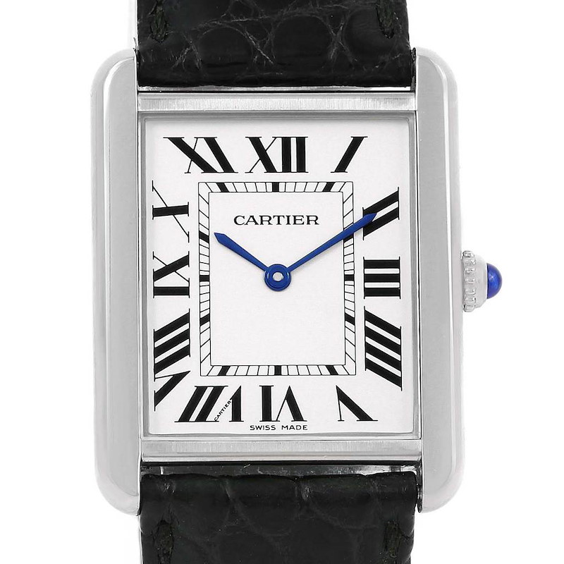 The image shows a front view of the Cartier Tank Solo watch, highlighting the dial, Roman numerals, blue hands, and part of the leather strap.